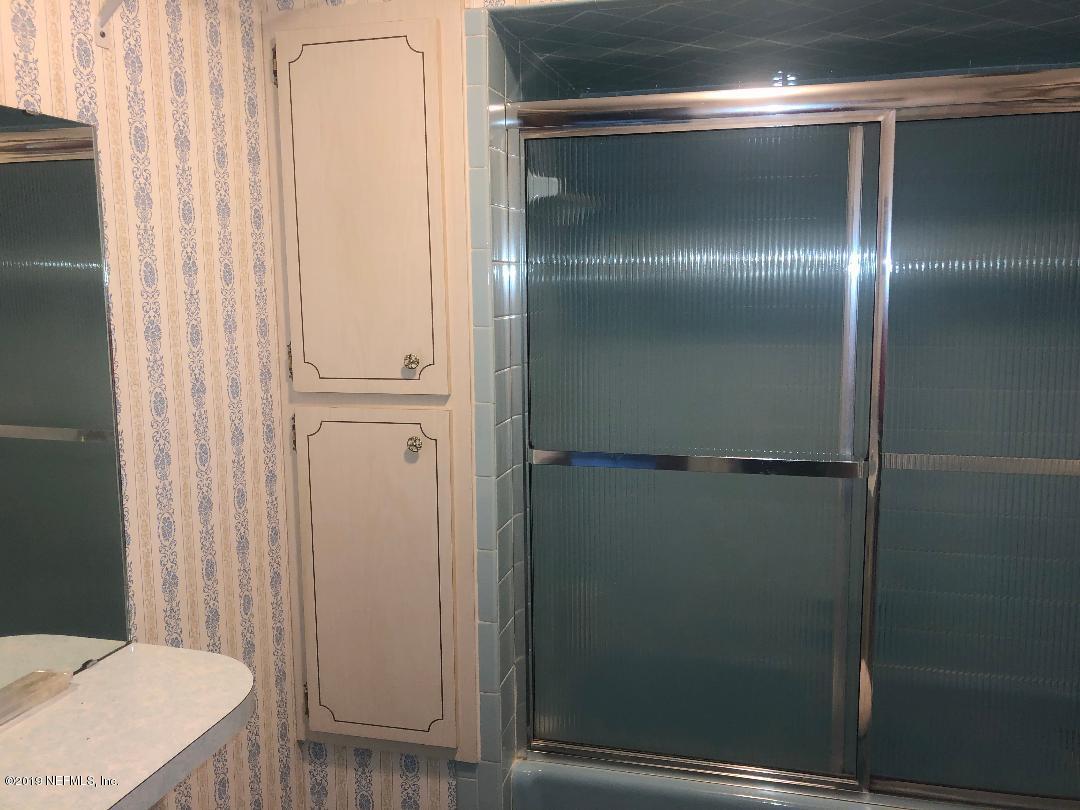 45142 Stratton Road Callahan, FL 32011 - Photo 25 of 29 a bathroom with a glass door shower
