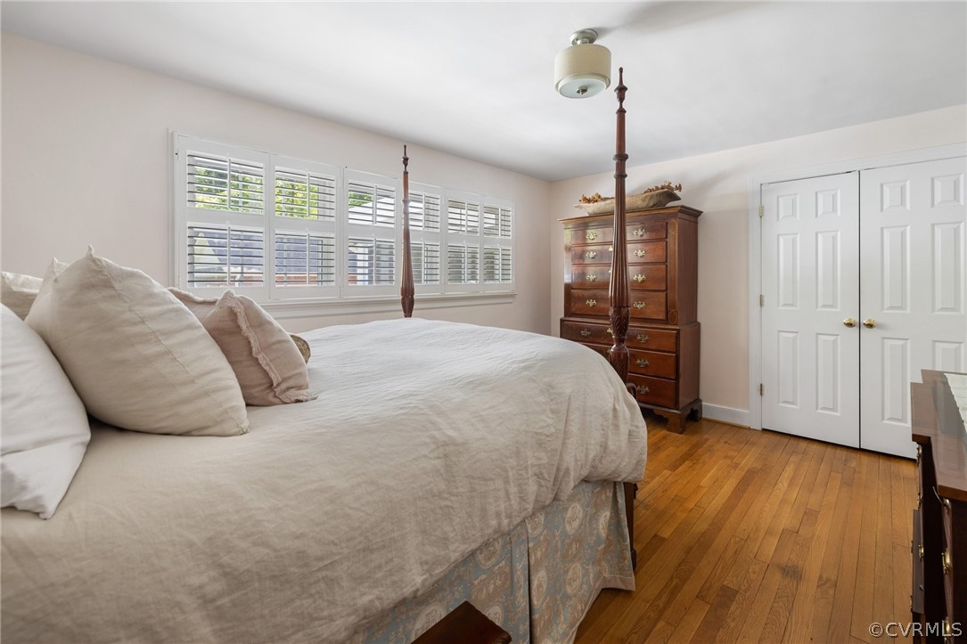 7658 Cherokee Road Richmond, VA 23225 - Photo 18 of 36 a bedroom with a bed and a walk in closet
