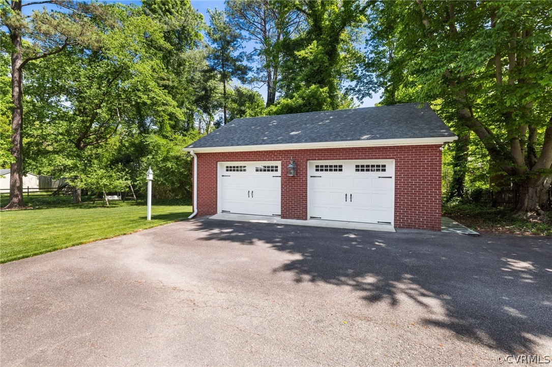 7658 Cherokee Road Richmond, VA 23225 - Photo 33 of 36 a view of a house with a yard and garage