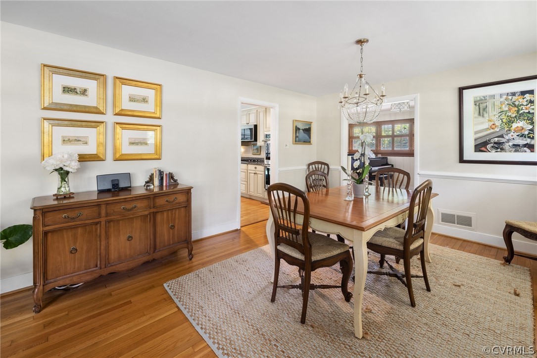 7658 Cherokee Road Richmond, VA 23225 - Photo 9 of 36 a view of a dining room with furniture window and wooden floor