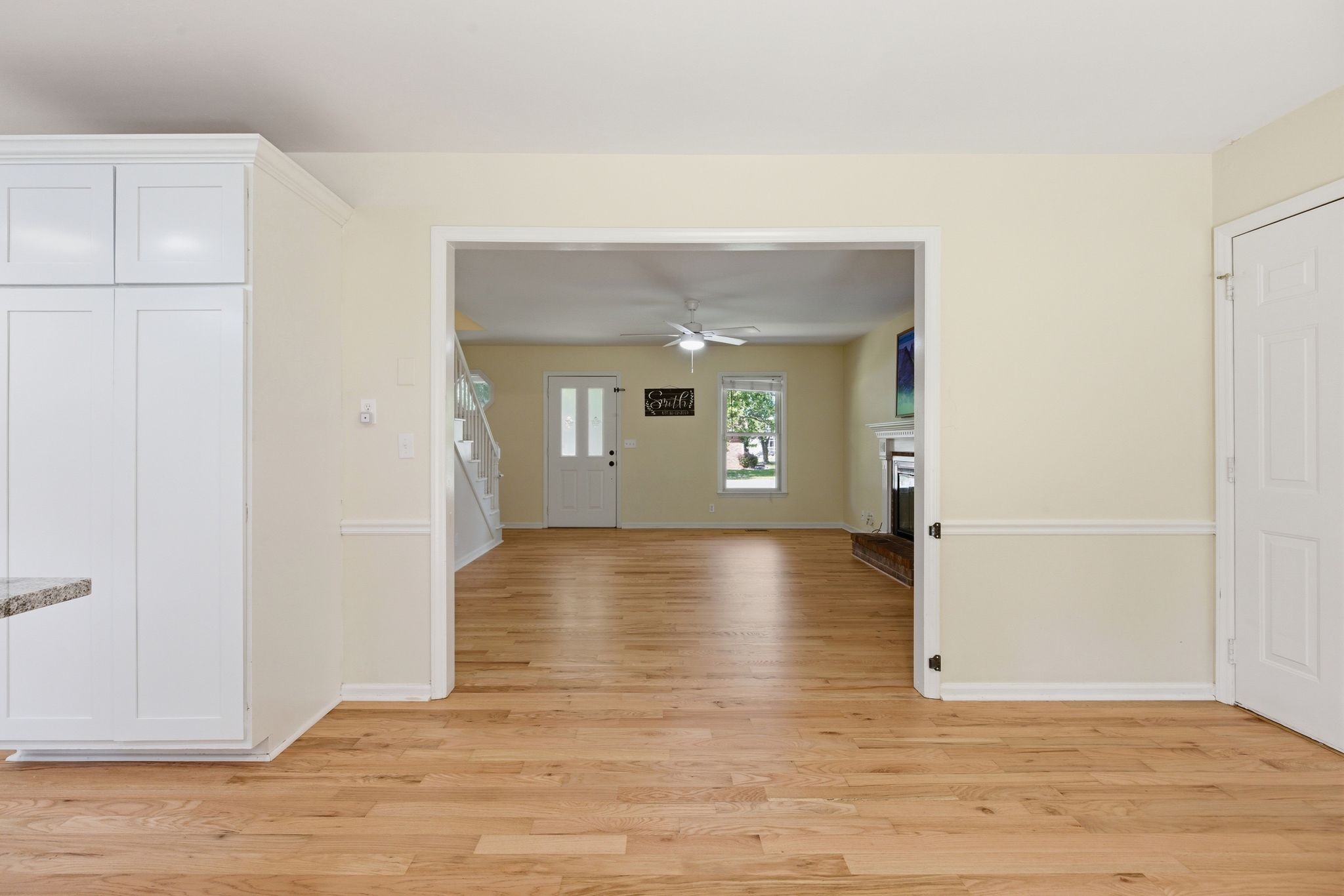 2306 Red Mile Road Murfreesboro, TN 37127 - Photo 12 of 43 a view of a livingroom with wooden floor and a refrigerator
