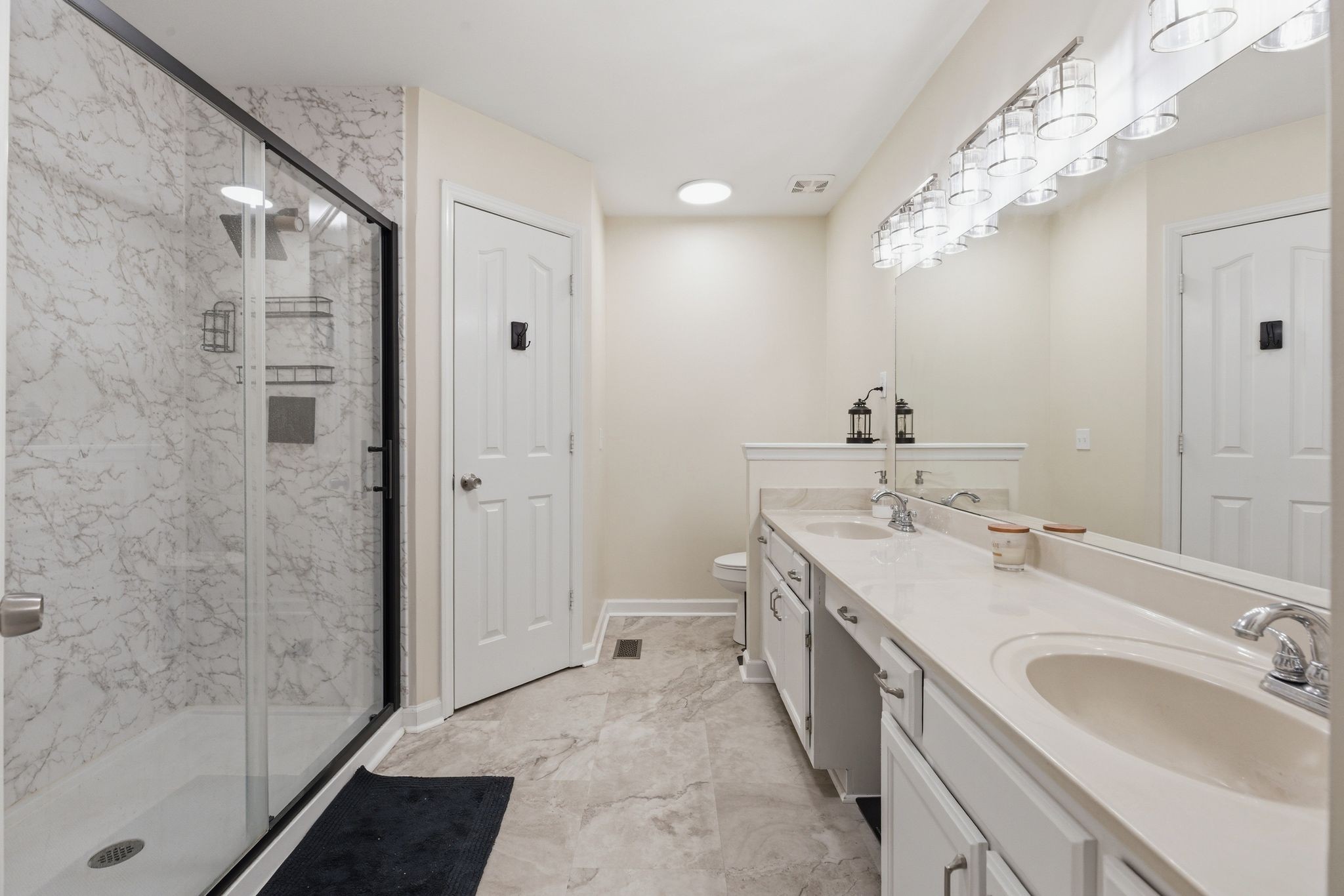 2306 Red Mile Road Murfreesboro, TN 37127 - Photo 21 of 43 a spacious bathroom with a double vanity sink mirror and shower