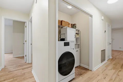 a view of a hallway with washer and dryer