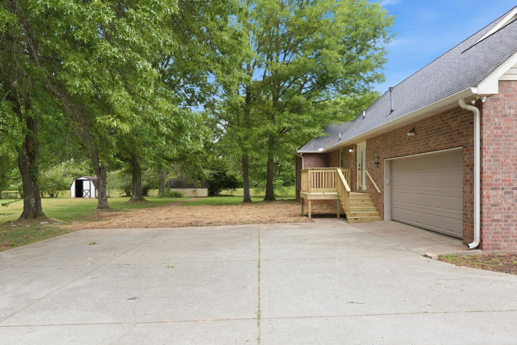 2306 Red Mile Road Murfreesboro, TN 37127 - Photo 40 of 43 a view of a house with a yard and garage