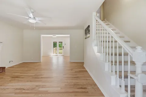 a view of an entryway with wooden floor