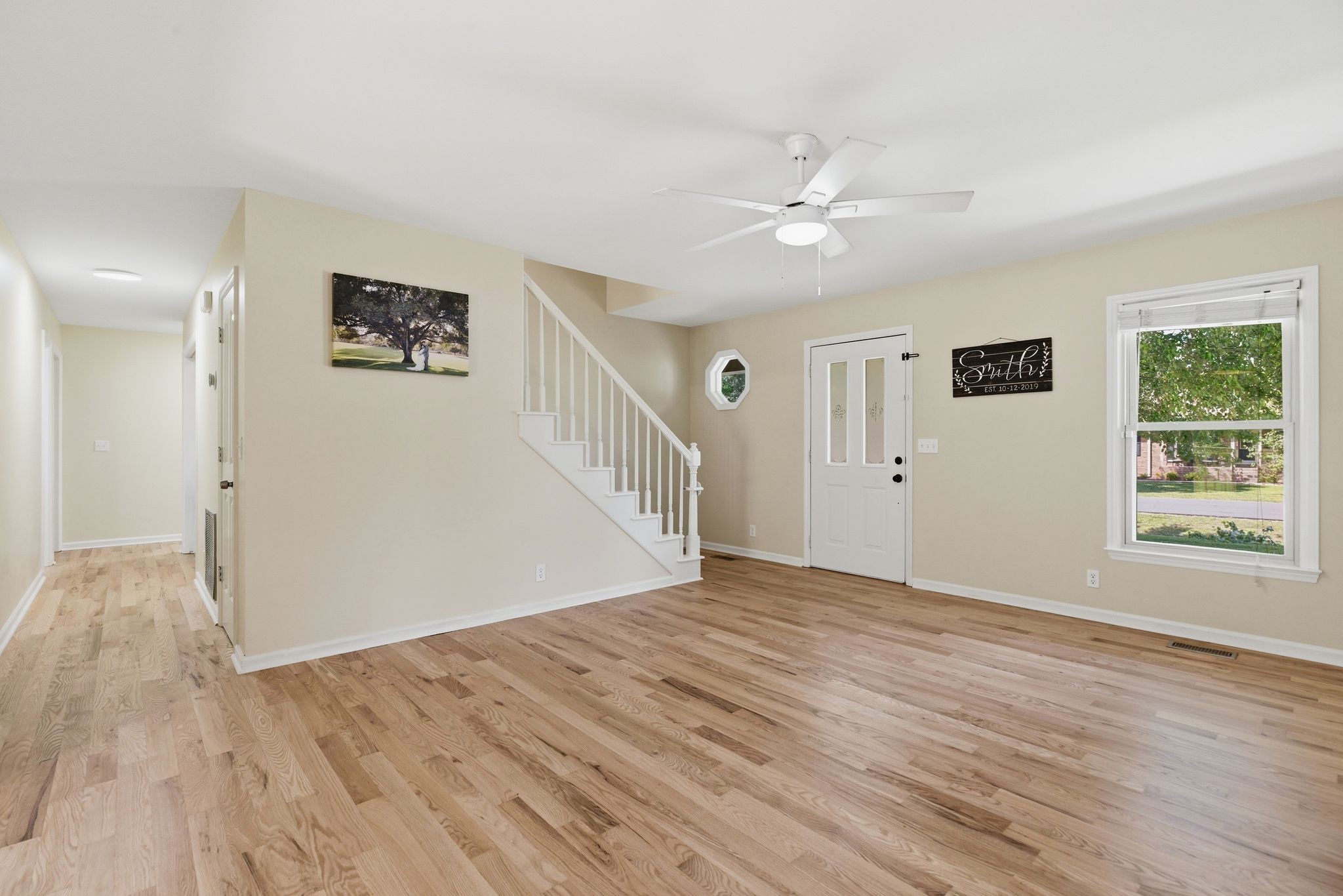 2306 Red Mile Road Murfreesboro, TN 37127 - Photo 7 of 43 a view of a livingroom with wooden floor and a ceiling fan