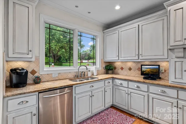 a kitchen with sink cabinets and window