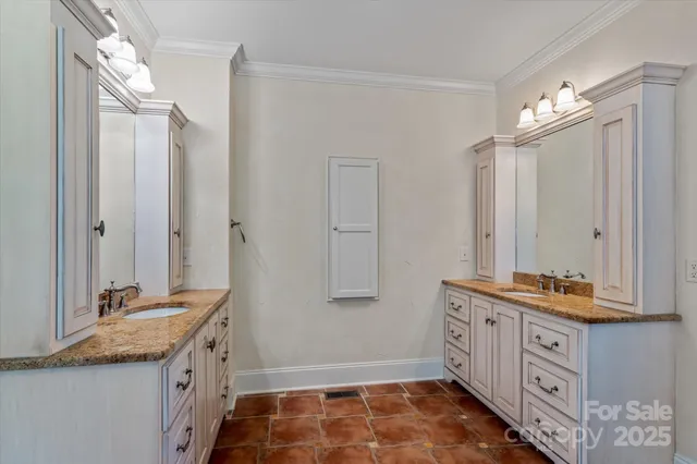 a bathroom with a double vanity sink mirror and
