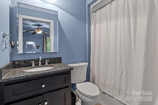 a bed room with a bed and a chair