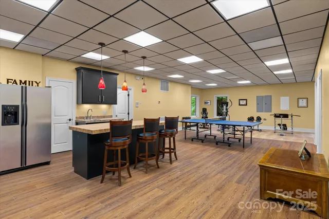 a room with gym equipment and a table