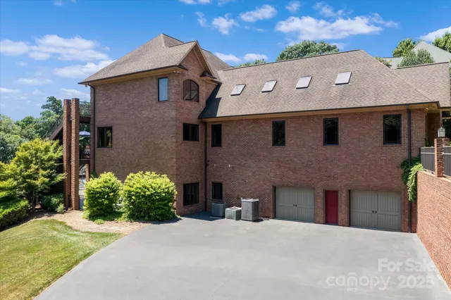 a view of a patio with table and chairs with wooden floor and fence
