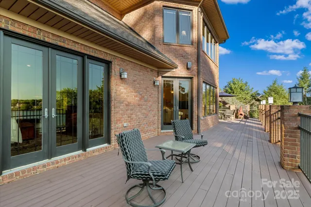 a view of balcony with furniture and wooden deck