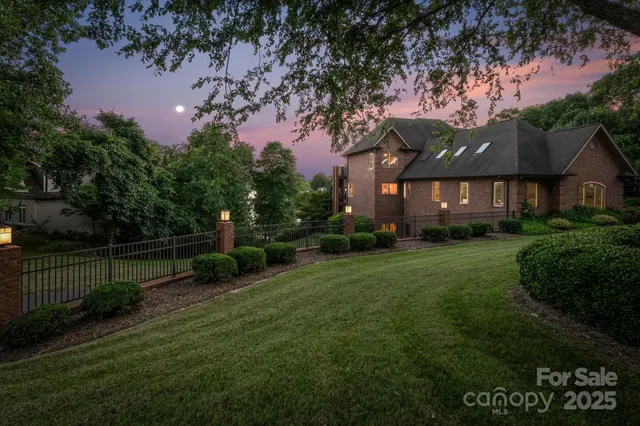 a front view of house with yard swimming pool and outdoor seating