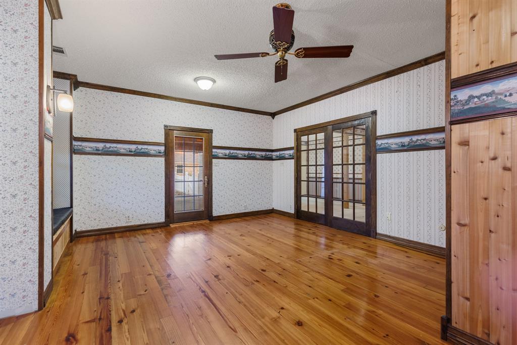 100 Linden Lane Hewitt, TX 76643 - Photo 15 of 31 a view of an empty room with wooden floor and a window