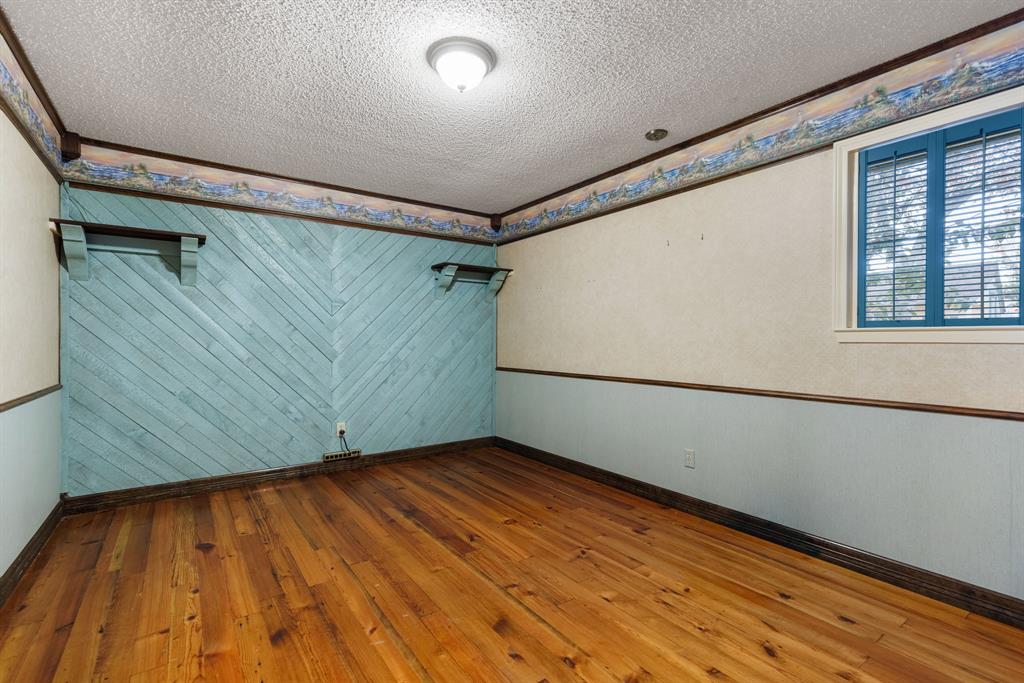 100 Linden Lane Hewitt, TX 76643 - Photo 16 of 31 a view of a room with wooden floor and white walls
