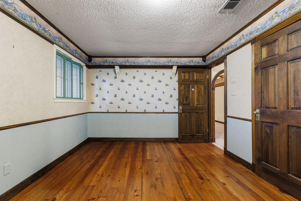 100 Linden Lane Hewitt, TX 76643 - Photo 17 of 31 a view of an empty room with wooden floor and a window