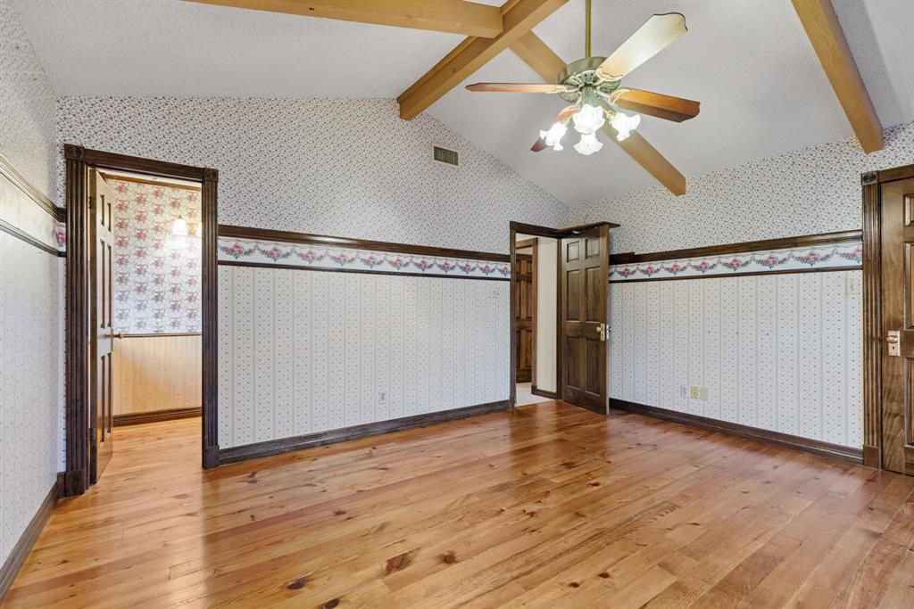 100 Linden Lane Hewitt, TX 76643 - Photo 23 of 31 a view of an empty room with wooden floor and a ceiling fan