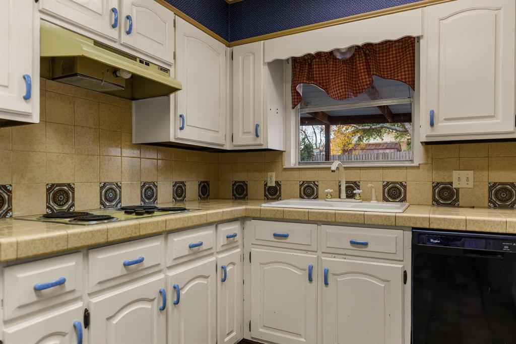 100 Linden Lane Hewitt, TX 76643 - Photo 9 of 31 a kitchen with stainless steel appliances granite countertop a sink a stove and cabinets