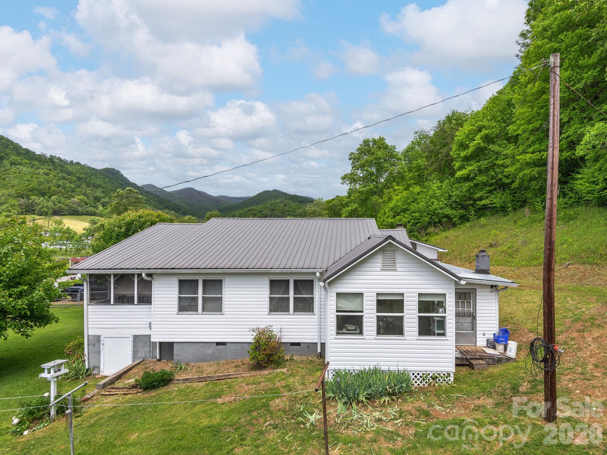 379 North Fork Road Barnardsville, NC 28709 - Photo 12 of 27 a front view of a house with a yard
