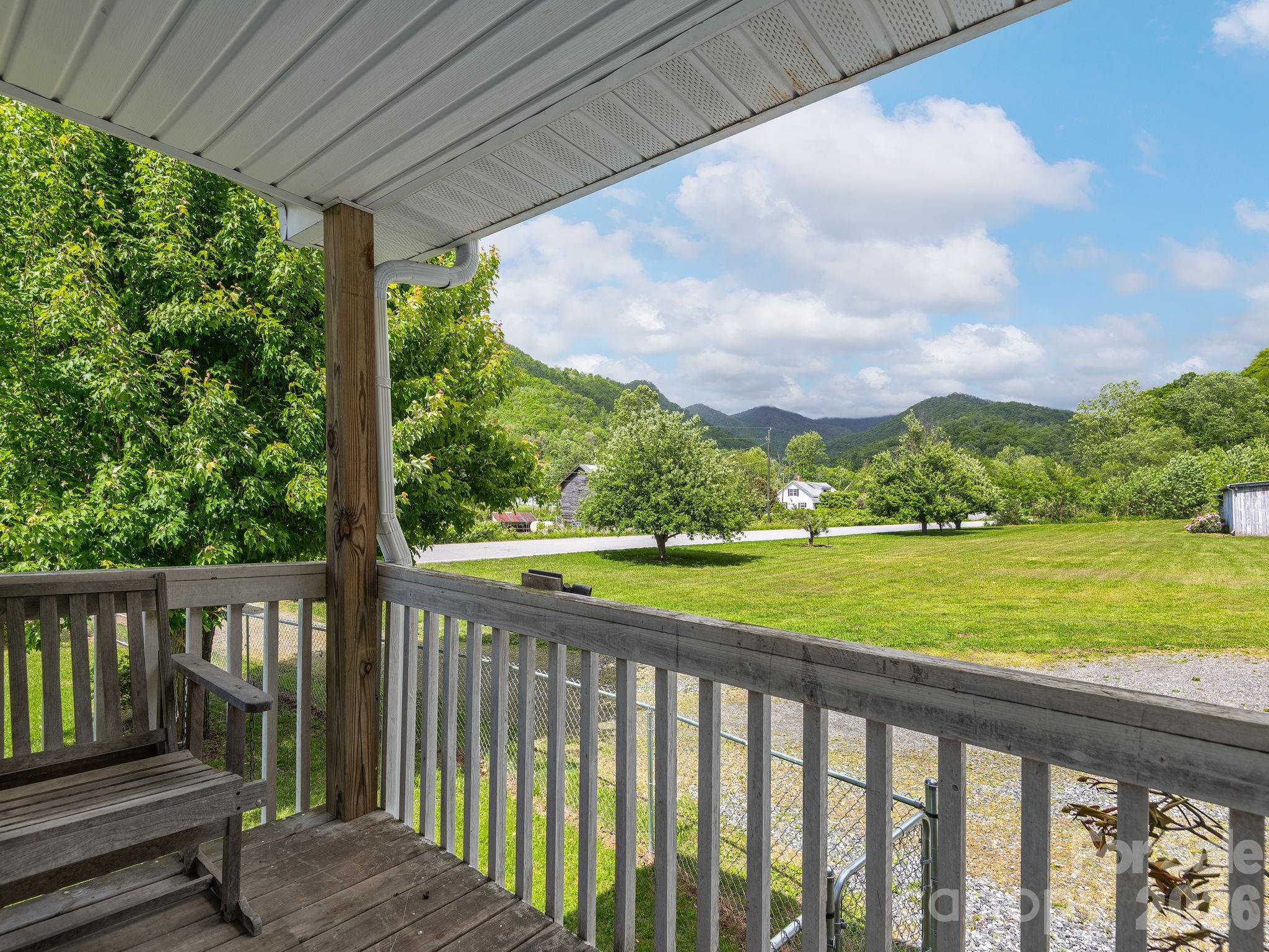 379 North Fork Road Barnardsville, NC 28709 - Photo 3 of 27 a view of a wooden deck next to a yard