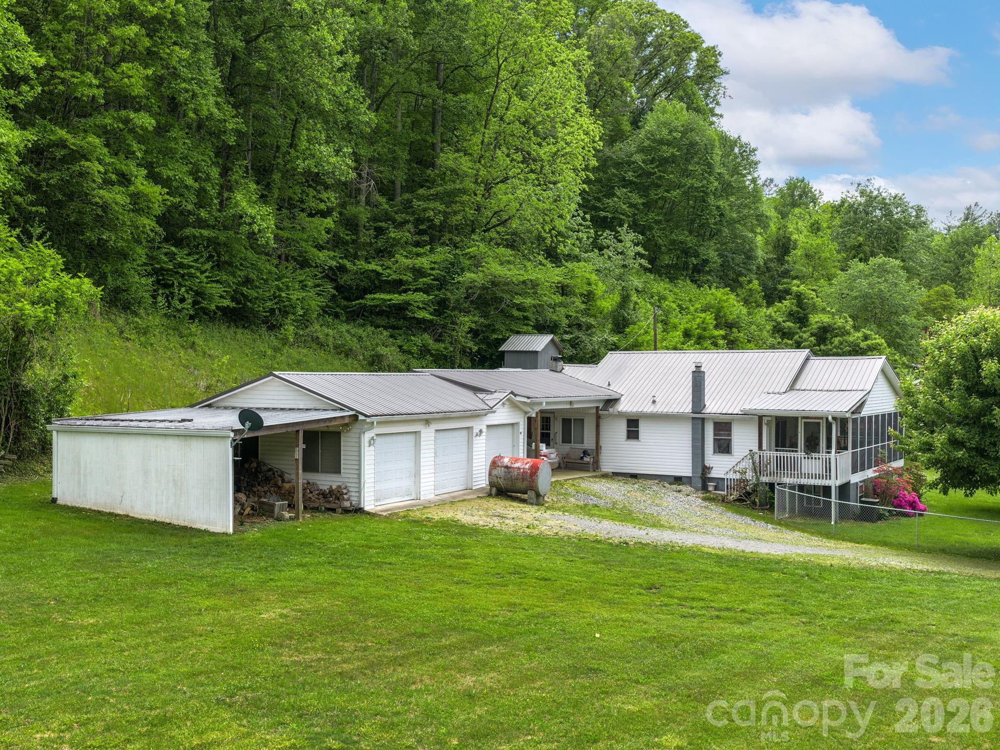 379 North Fork Road Barnardsville, NC 28709 - Photo 4 of 27 a aerial view of a house with swimming pool and garden