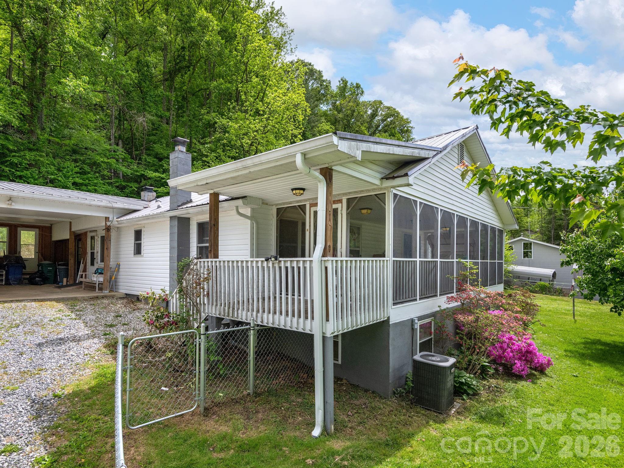379 North Fork Road Barnardsville, NC 28709 - Photo 5 of 27 a view of a house with a yard and sitting area
