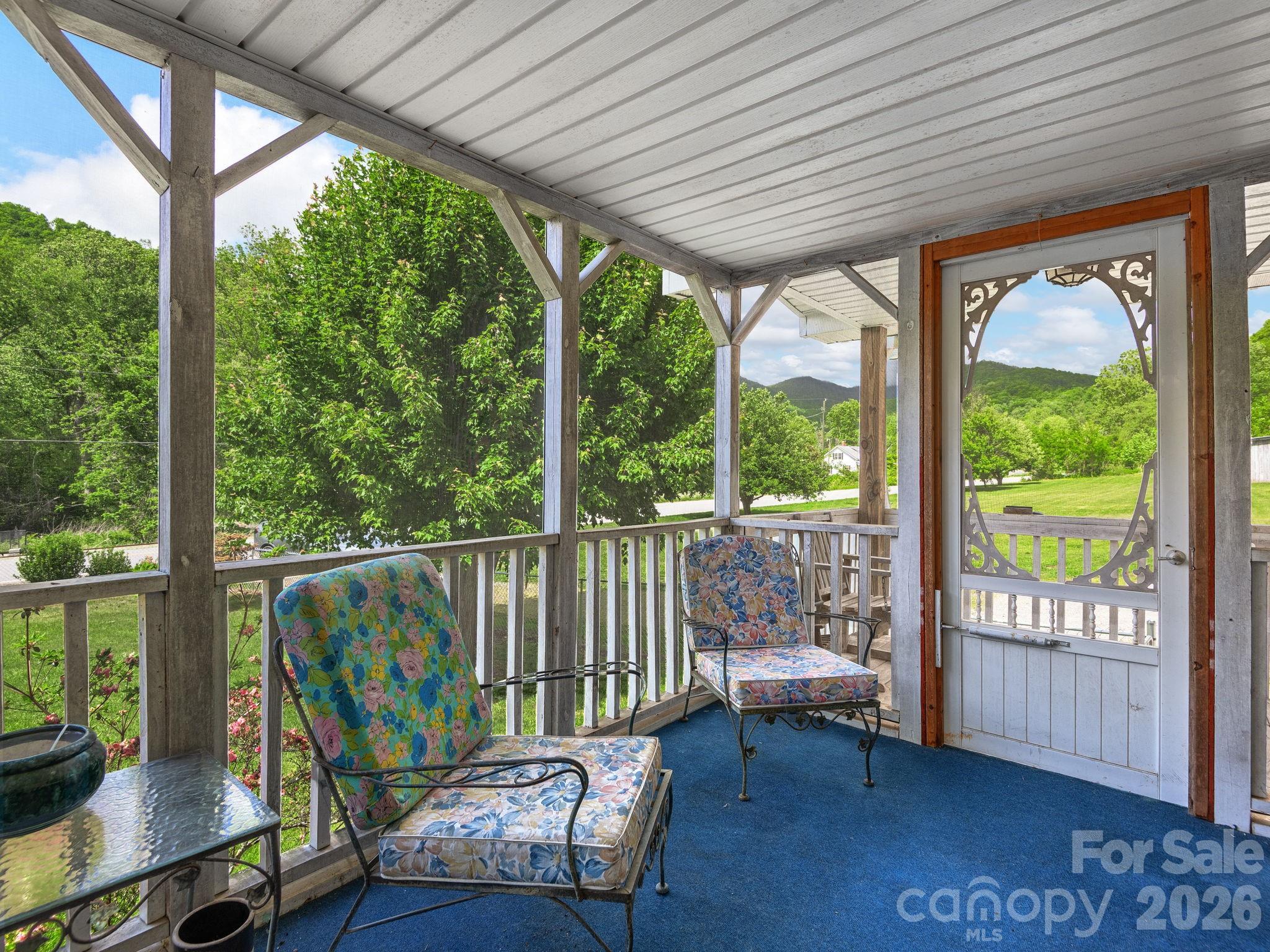 379 North Fork Road Barnardsville, NC 28709 - Photo 6 of 27 a balcony with furniture and wooden floor