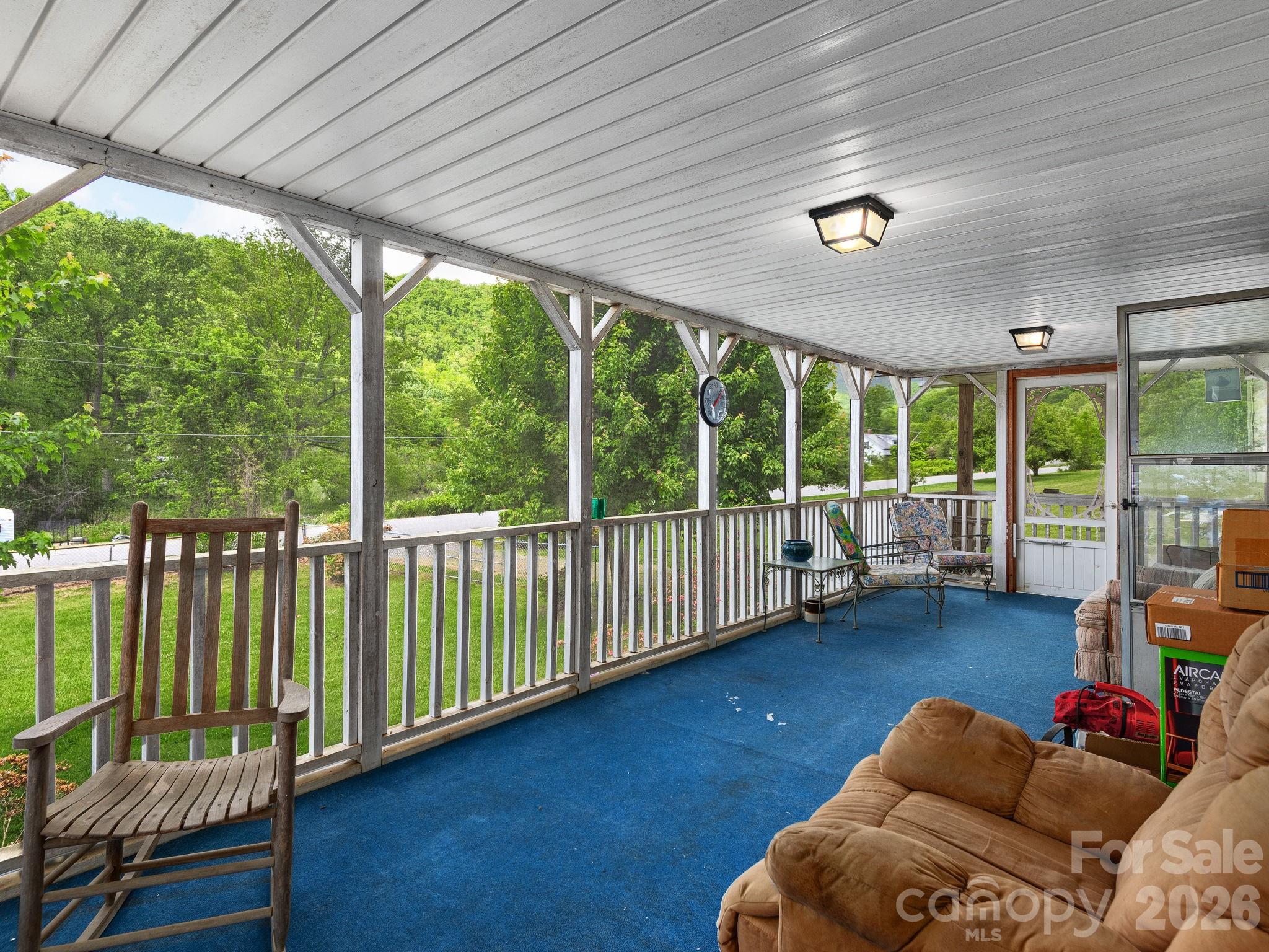 379 North Fork Road Barnardsville, NC 28709 - Photo 7 of 27 a living room with furniture and a large window
