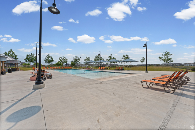 878 North Old Rnch Road Lehi, UT 84048 - Photo 35 of 36 Expansive outdoor pool area with substantial concrete decking