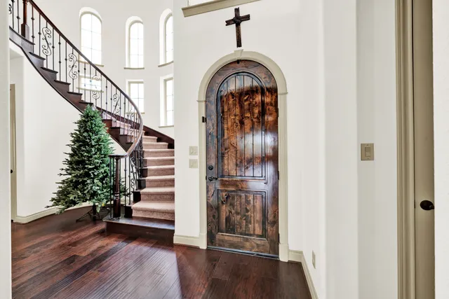 a view of entryway and hall with wooden floor