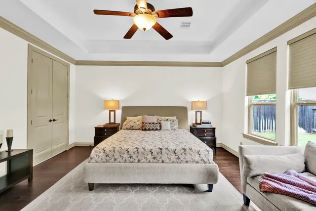 a bathroom with a granite countertop sink mirror and a shower