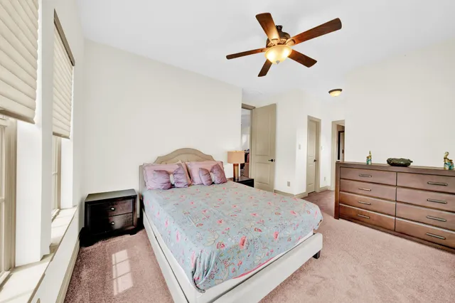 a bed room with furniture and a window