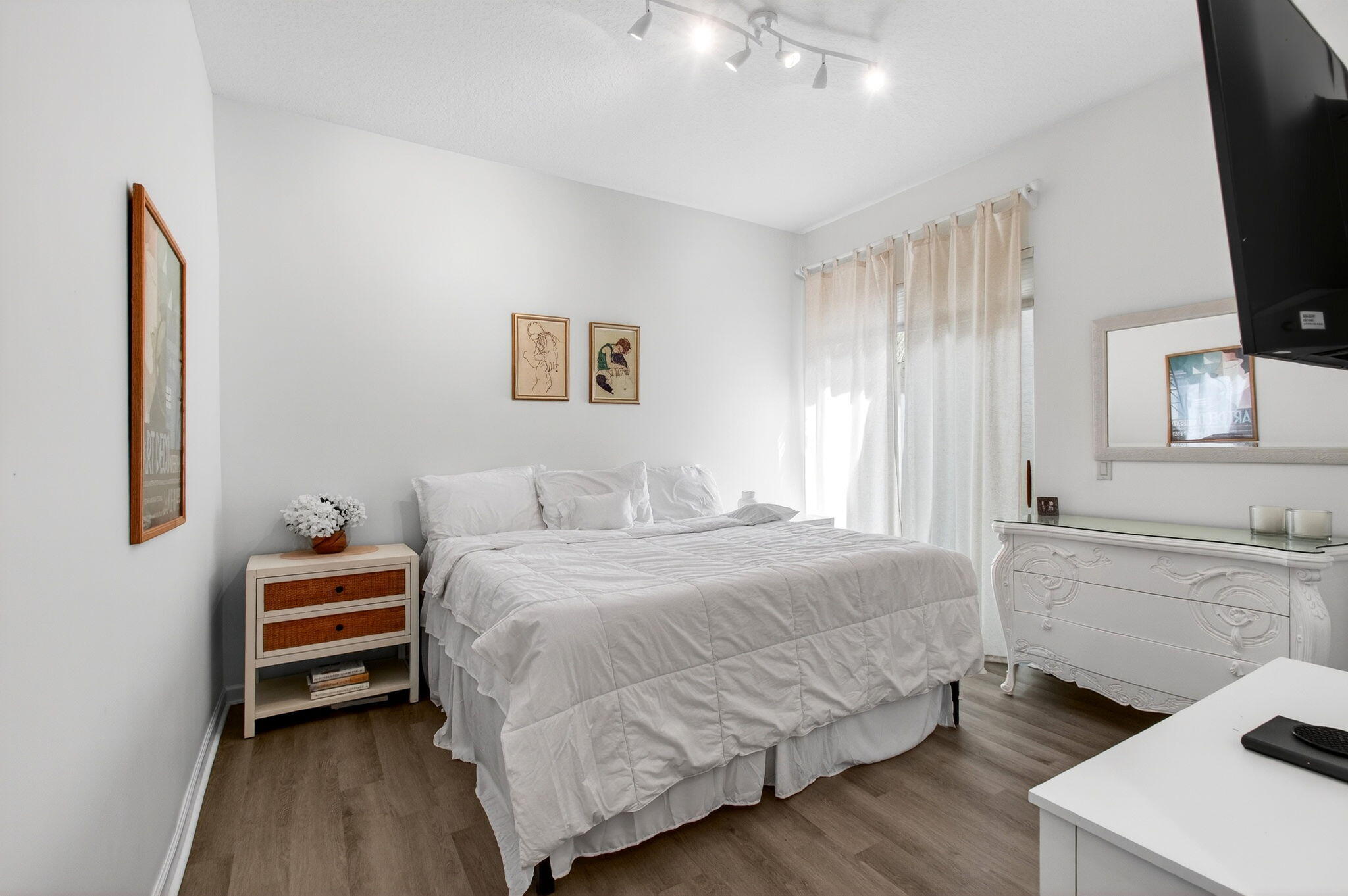 17728 Villa Club Way Boca Raton, FL 33496 - Photo 15 of 36 a bedroom with a bed and a flat screen tv