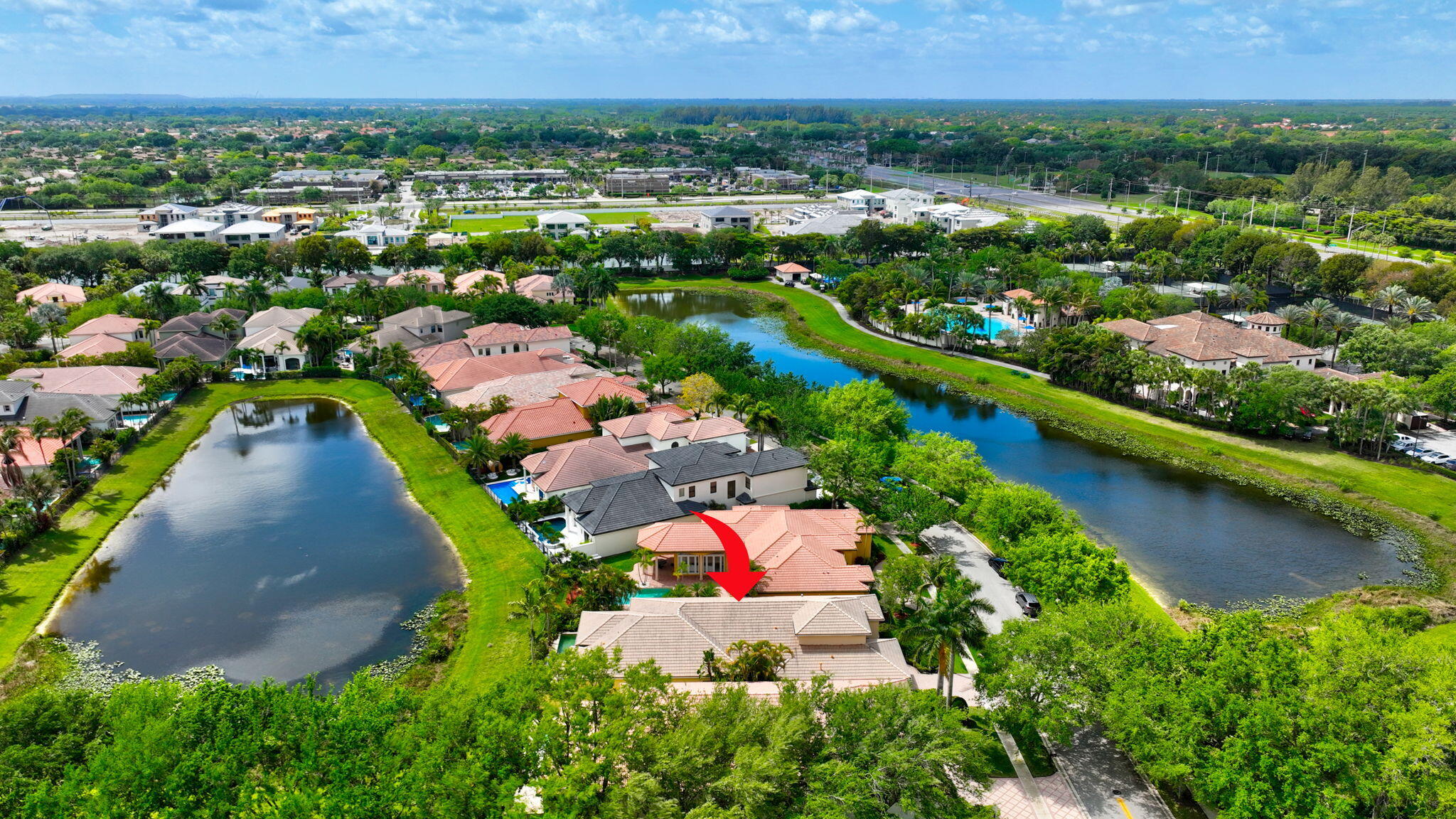 17728 Villa Club Way Boca Raton, FL 33496 - Photo 25 of 36 an aerial view of residential houses with outdoor space and lake view