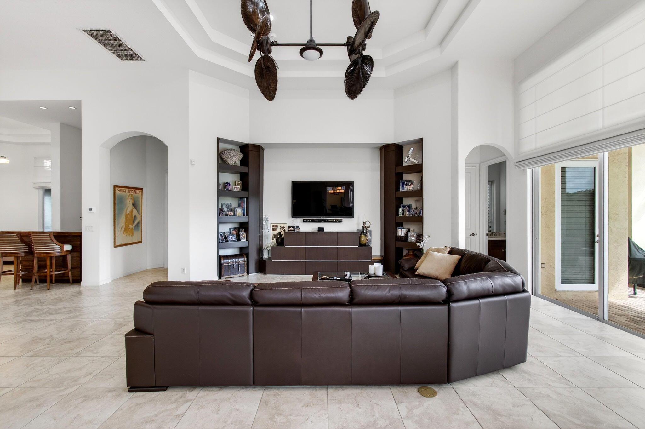17728 Villa Club Way Boca Raton, FL 33496 - Photo 9 of 36 a living room with furniture and a flat screen tv