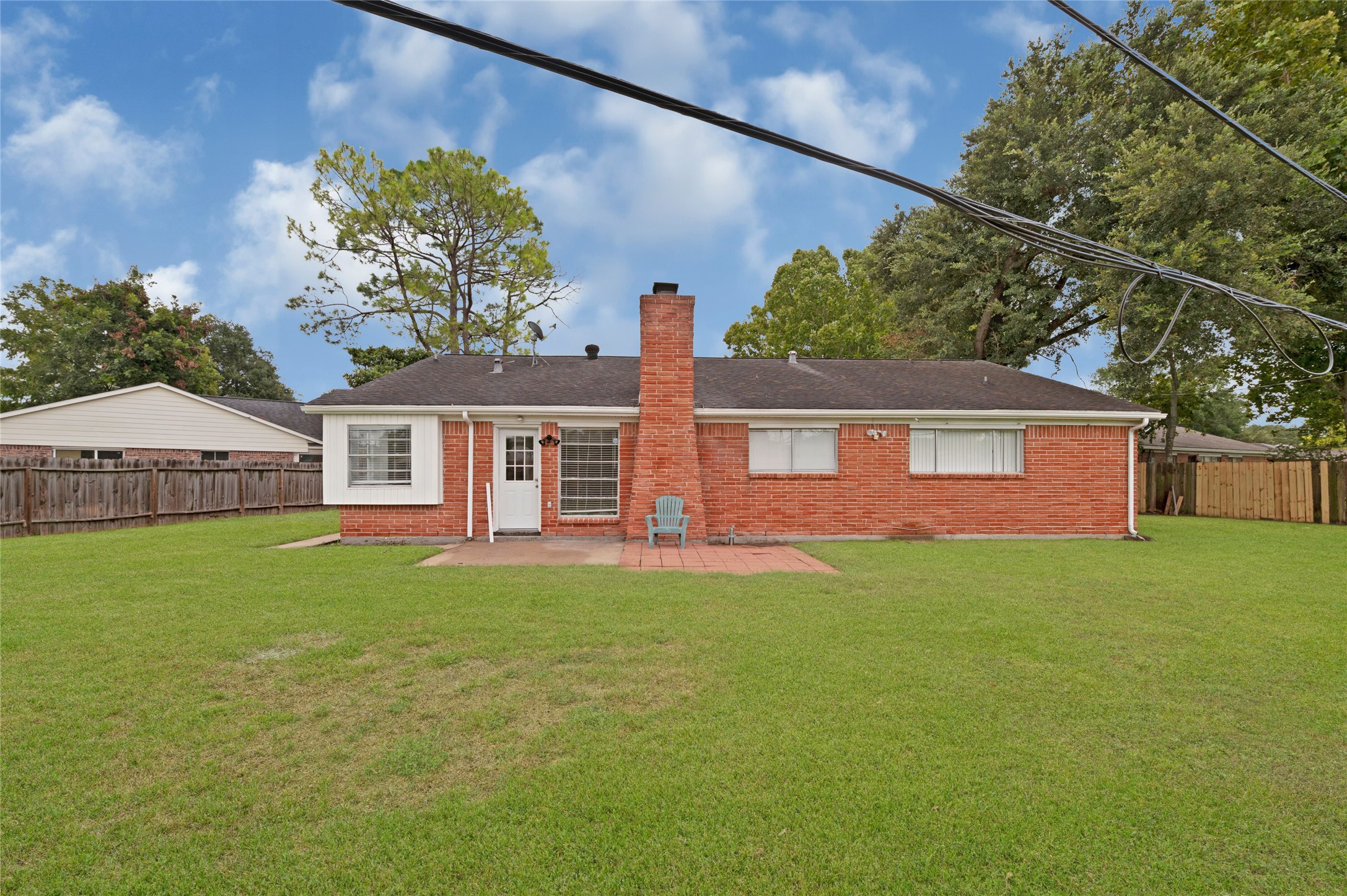 7302 Redding Road Houston, TX 77036 - Photo 17 of 26 a front view of a house with a garden and yard