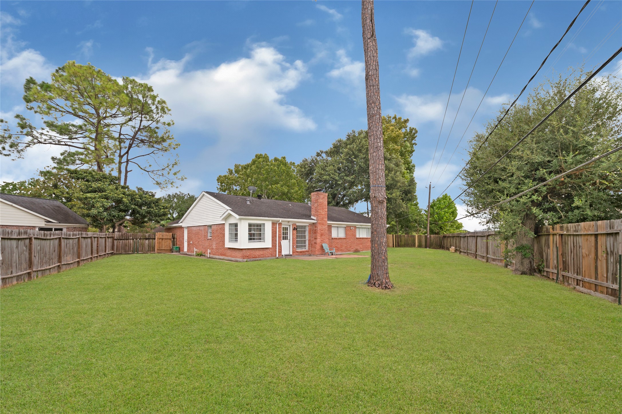 7302 Redding Road Houston, TX 77036 - Photo 18 of 26 a view of a house with a yard and tree