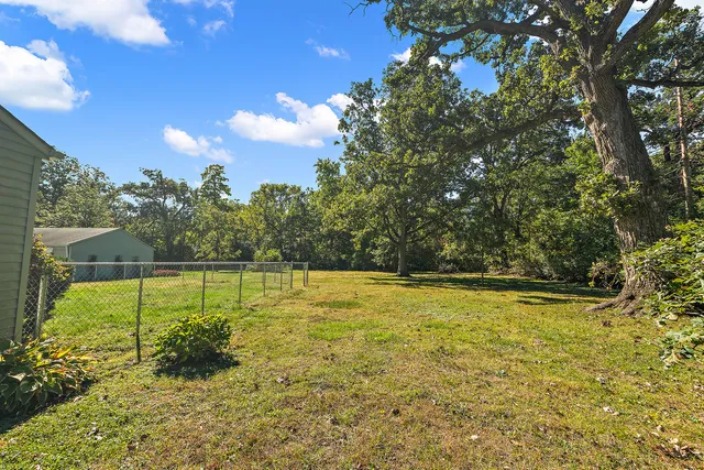 a view of a swimming pool with an outdoor space and seating area