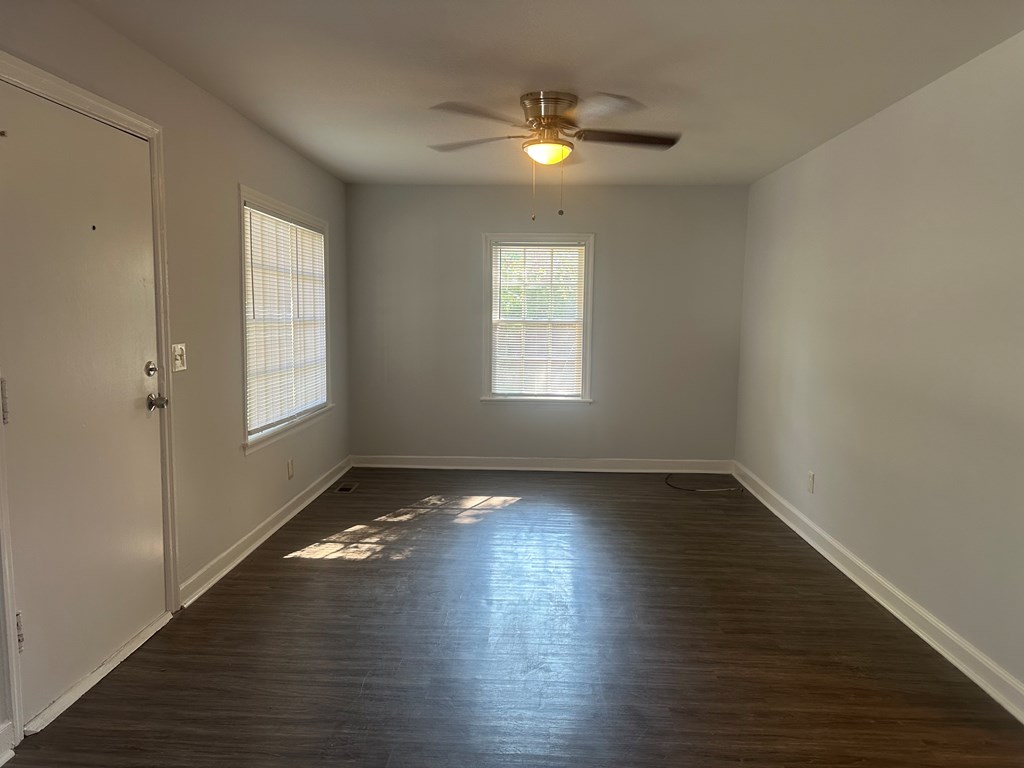 5636 Hunter Road Columbus, GA 31907 - Photo 3 of 10 an empty room with wooden floor and windows