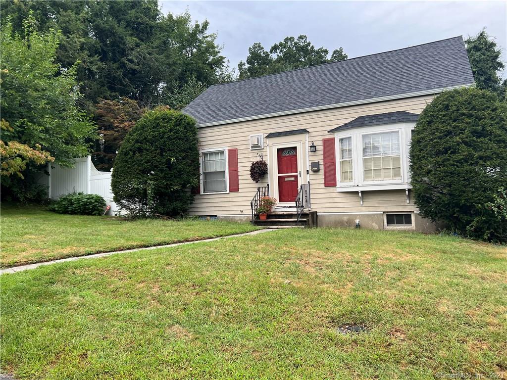 39 Glendale Drive Waterbury, CT 06708 - Photo 1 of 1 a front view of house with outdoor seating and yard