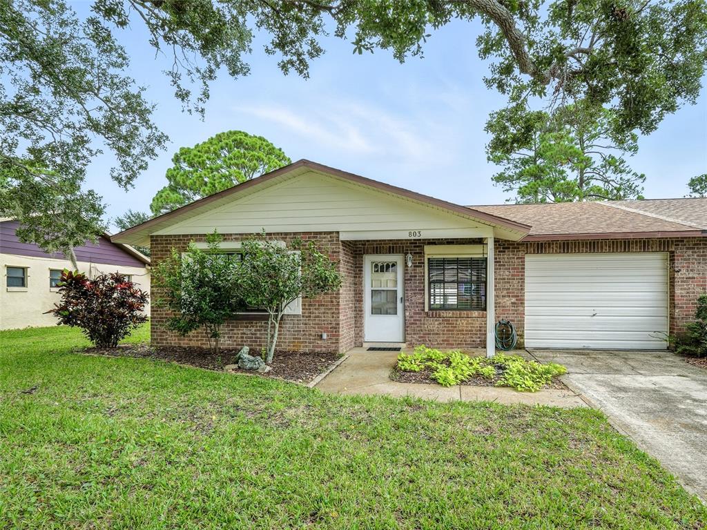 front view of a house with a yard