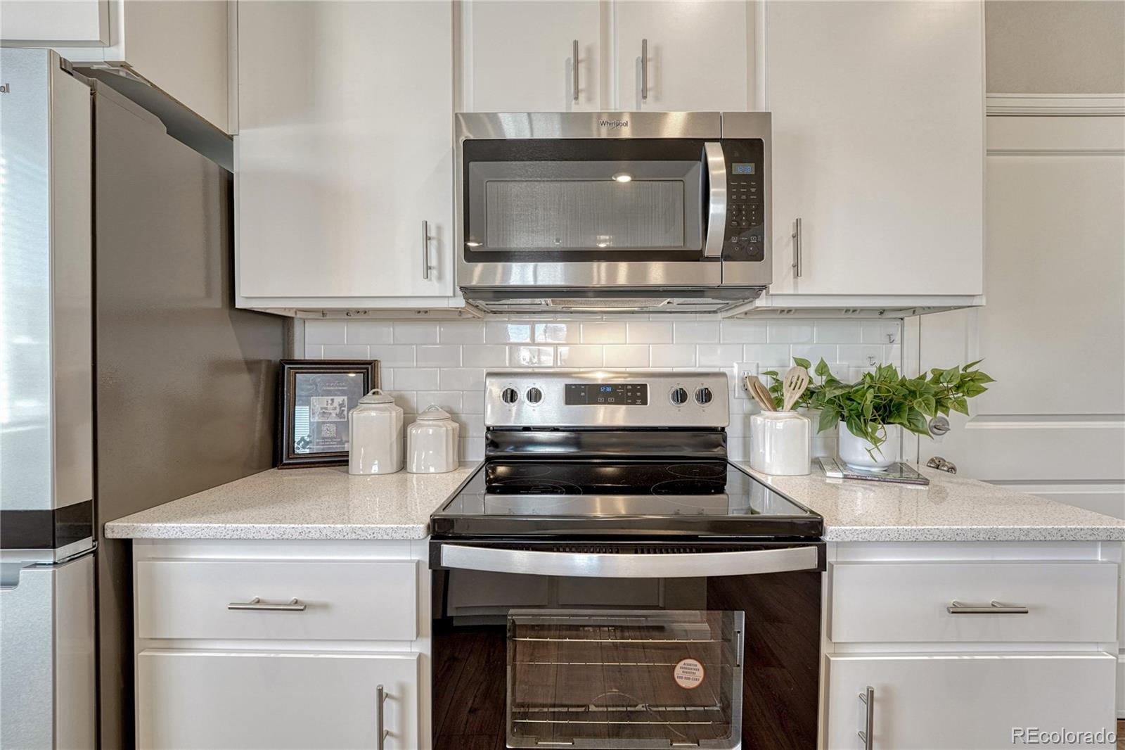 5861 Dakan Loop Colorado Springs, CO 80927 - Photo 12 of 29 a stove top oven sitting inside of a kitchen and sink