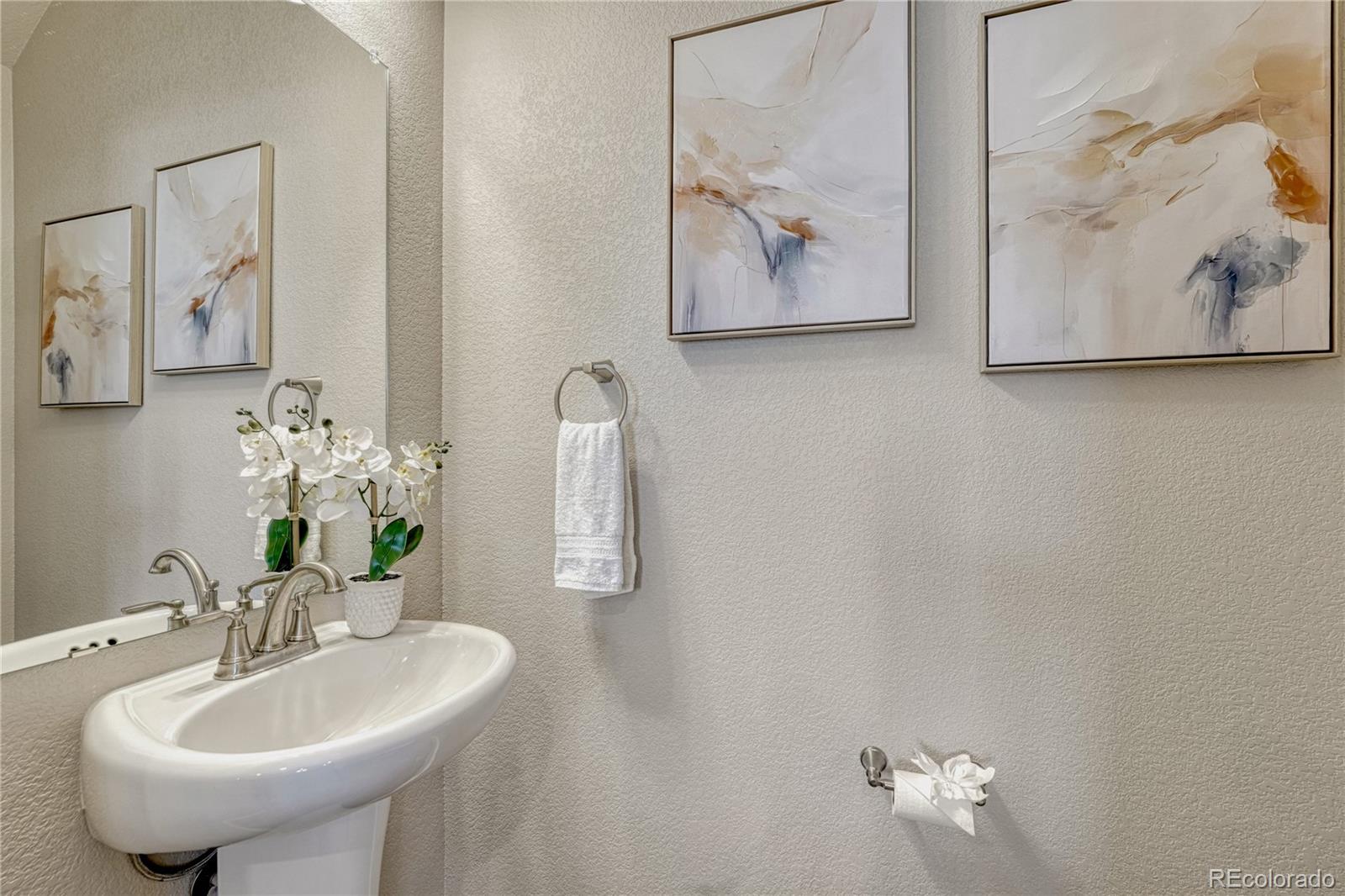 5861 Dakan Loop Colorado Springs, CO 80927 - Photo 14 of 29 a bathroom with a sink and a mirror