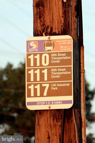 a view of a house with brick walls and a yard with windows