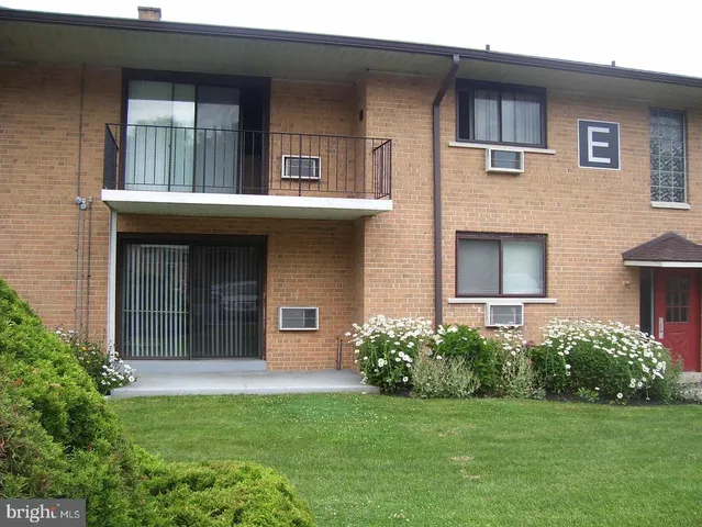 a view of two chair in front of house
