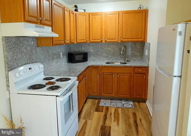 a kitchen with a stove and a sink