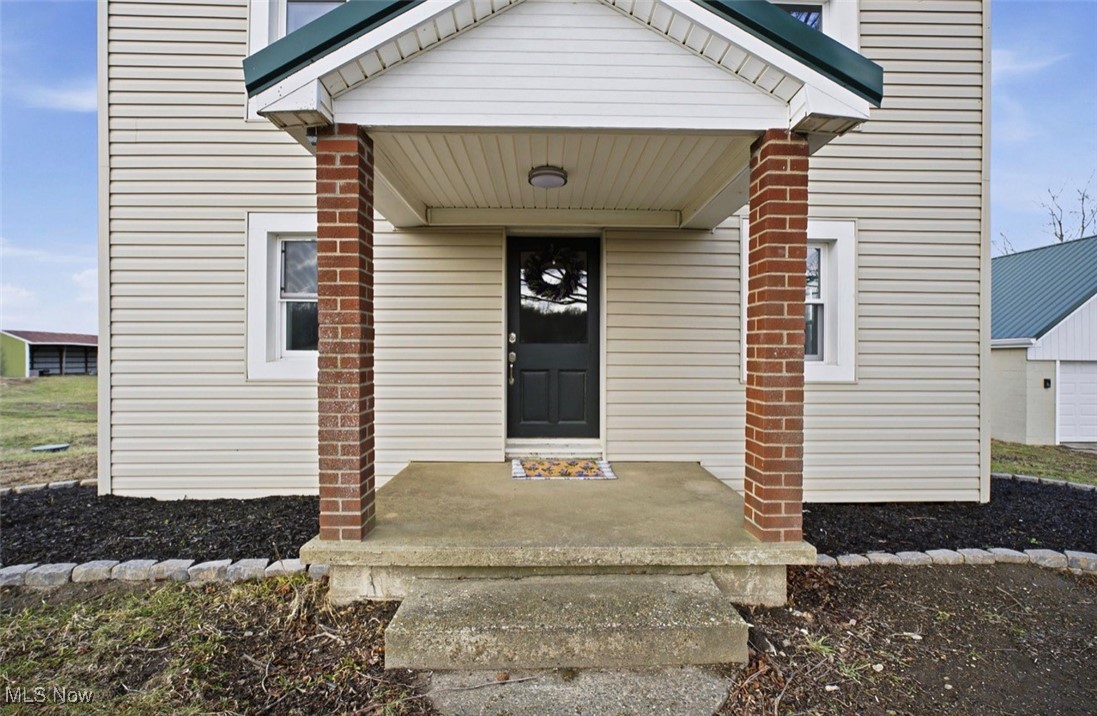 1635 Irish Ridge Road Philo, OH 43771 - Photo 36 of 48 View of exterior entry featuring a porch