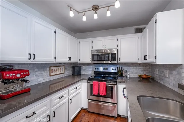 a bedroom with a bed a table and a large window