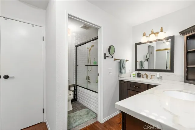 a spacious bathroom with a sink vanity and a mirror