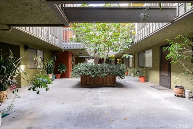 a view of a building with car parked